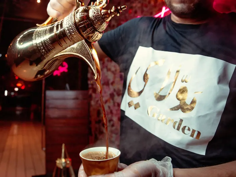Arabic qahwa poured into a small handleless cup
